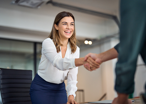 female shaking hands with a client